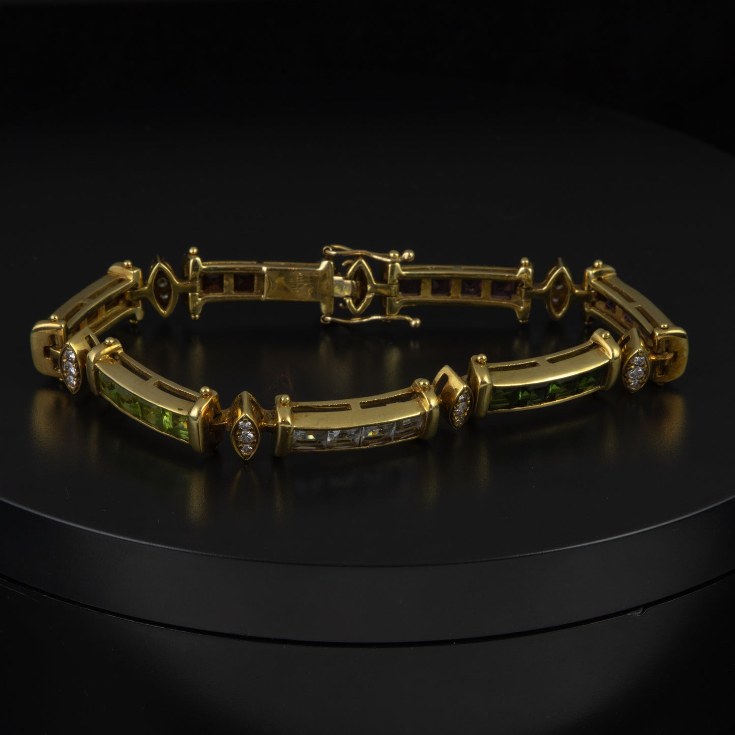 Pulsera combinada en oro amarillo, diamantes talla brillante y topacios, amatistas, tsavoritas, aguamarinas, citrinos y granates talla princesa 28 x 0,20 qts.