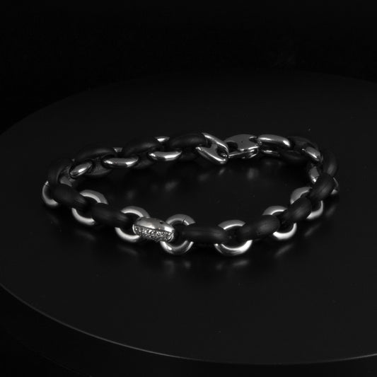 Pulsera de caballero de calabrotes de caucho y acero con un eslabón de acero y brillantes blancos de Rabat. Medida total de 17cm.