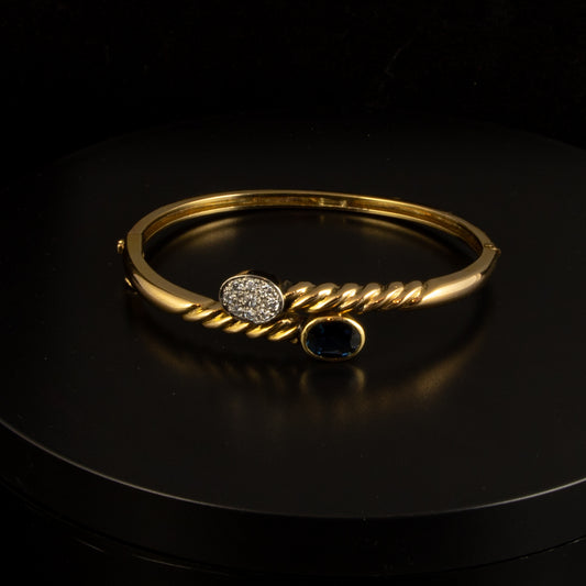 Pulsera en oro amarillo, brillantes y rubi.