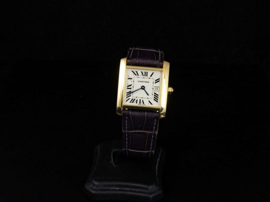 Cartier Tank Française en oro con correa de piel.