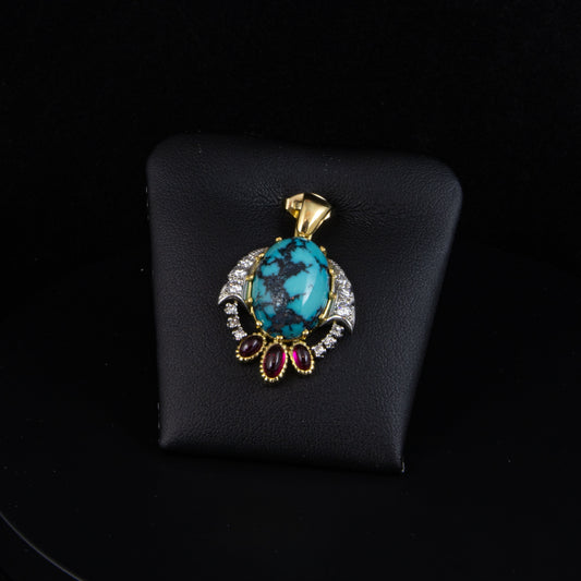 Colgante oro amarillo, brillantes, turquesas y piedras rojas.