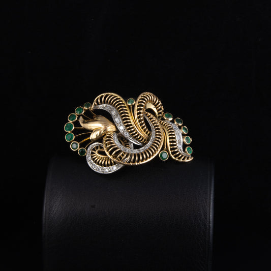 Broche en oro amarillo, esmeraldas, diamantes de los años 50.
