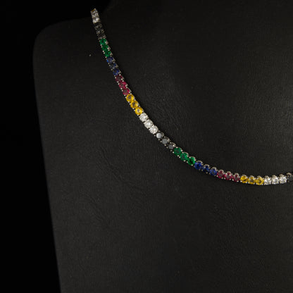 Gargantilla riviere con brillantes multicolor, zafiros, rubies, esmeralda y diamante amarillo y negro.