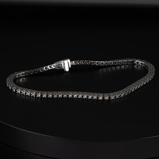 Riviere oro blanco y diamantes 0,02 qts. x 70 con un total de 1,4 qts.