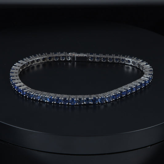 Riviere oro blanco y zafiros.