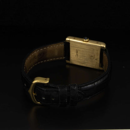 Cartier Tank Louis Cartier, en oro con correa de piel. Cuerda manual.