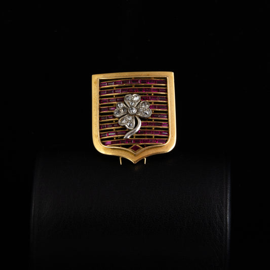 Broche escudo oro, rubis y diamantes
