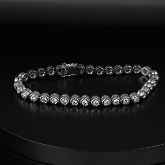 Riviere en oro blanco y diamantes 0,18 qts. x 35 con un total de 6,3 qts.