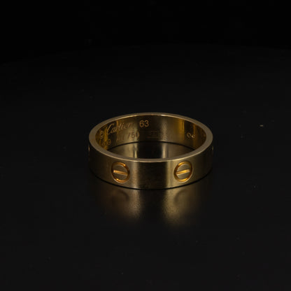 Anillo Cartier LOVE "EA" en Oro Amarillo 18K. Talla 103