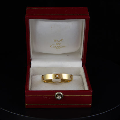 Anillo Cartier LOVE "EA" en Oro Amarillo 18K. Talla 103
