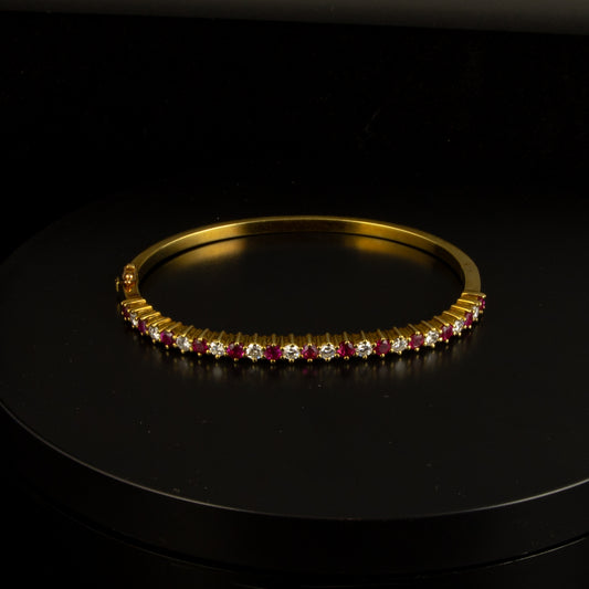 Esclava oro amarillo con diamantes 0.18*12 cts. y rubis 0.17*13 cts.