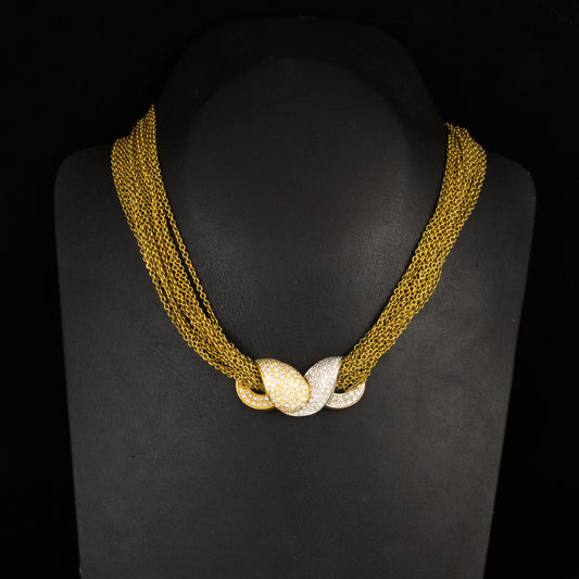 Collar estetica años 80 en oro amarillo con 16 cadenas y broche de diamantes.
