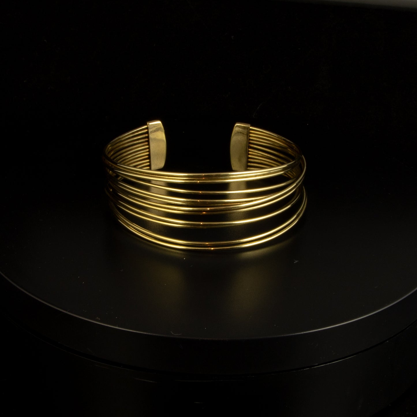 Esclava abierta oro amarillo multihilo.