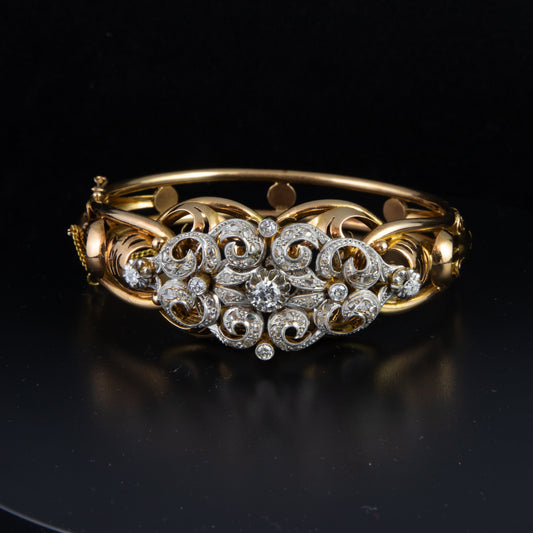 Pulsera desmontable en broche en oro rosa con diamante central de años 40.