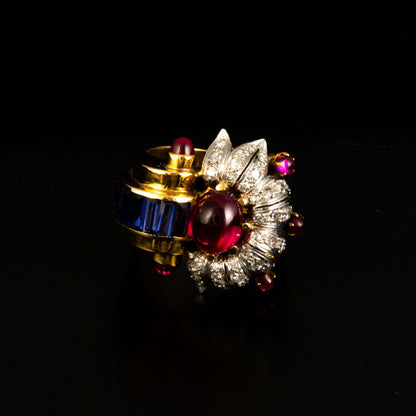 Anillo oro, brillantes, piedras azules y roja.